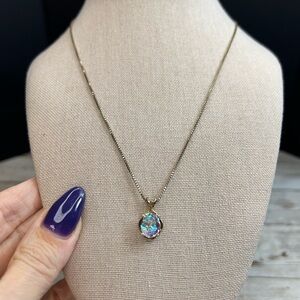 Elegant Gold Necklace with Iridescent Pendant